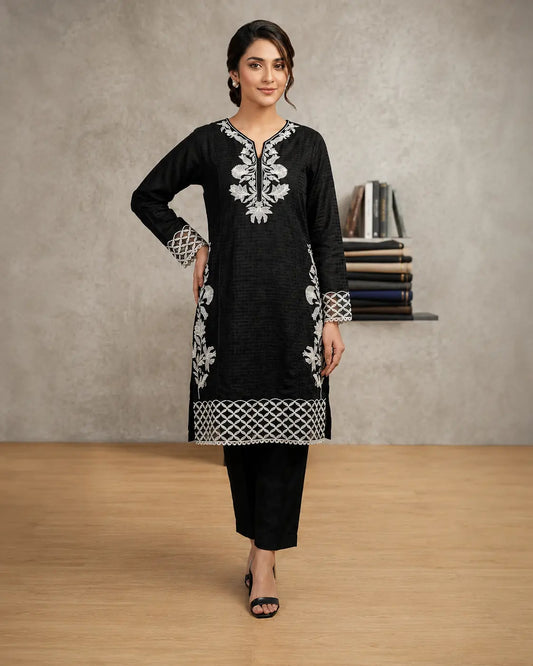 Black Orchid – Inspired by the delicate white floral embroidery against the deep black canvas.